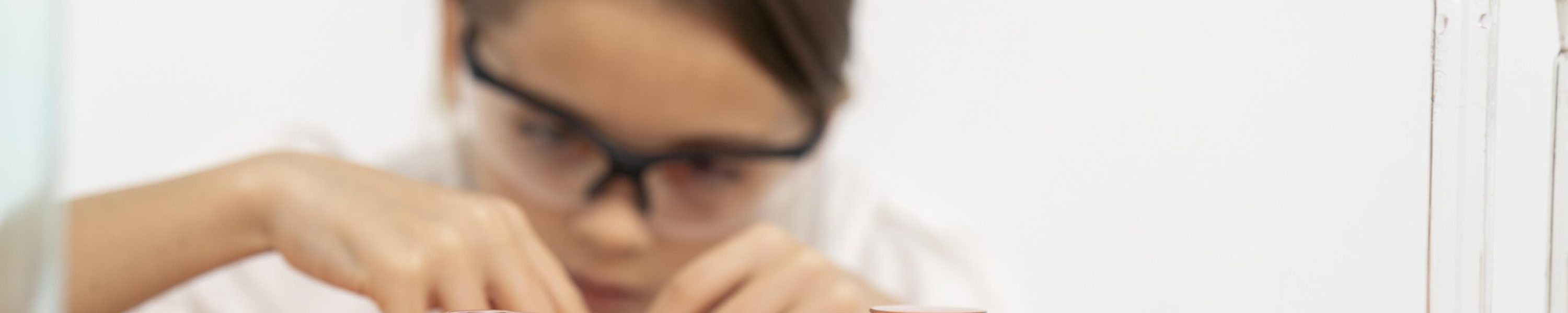 girl-with-safety-glasses-doing-chemistry-experiments